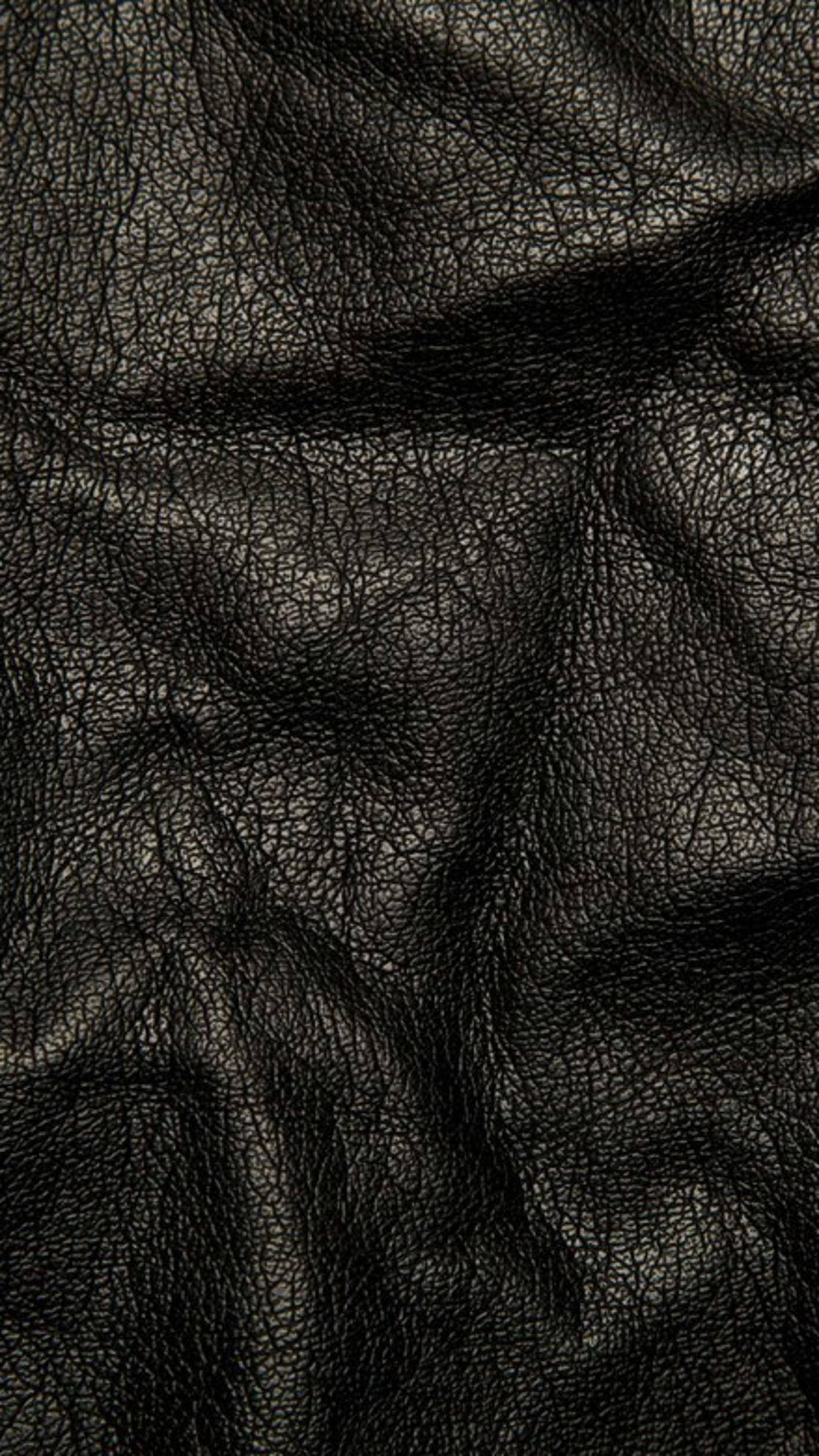 Arvoituksellista eleganssia: Rypytetty nahka 4K Ultra HD tumma puhelimen taustakuva Taustakuvat