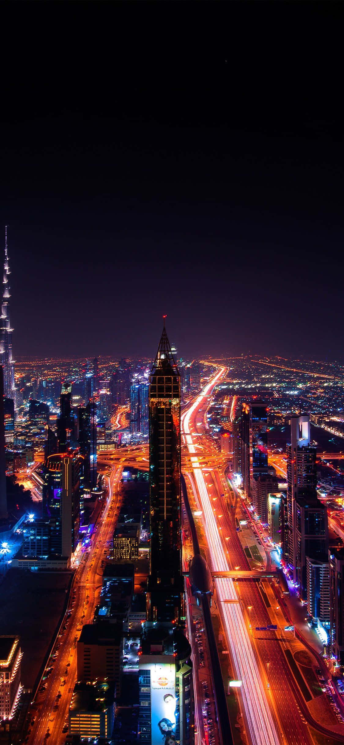 Dubain kaupunki iPhone-näytöllä yöllä Taustakuvat