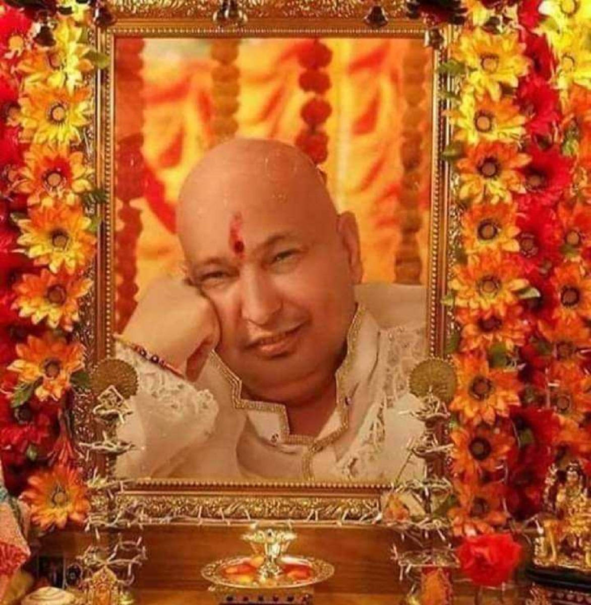 Guru Ji muotokuva auringonkukkien kanssa