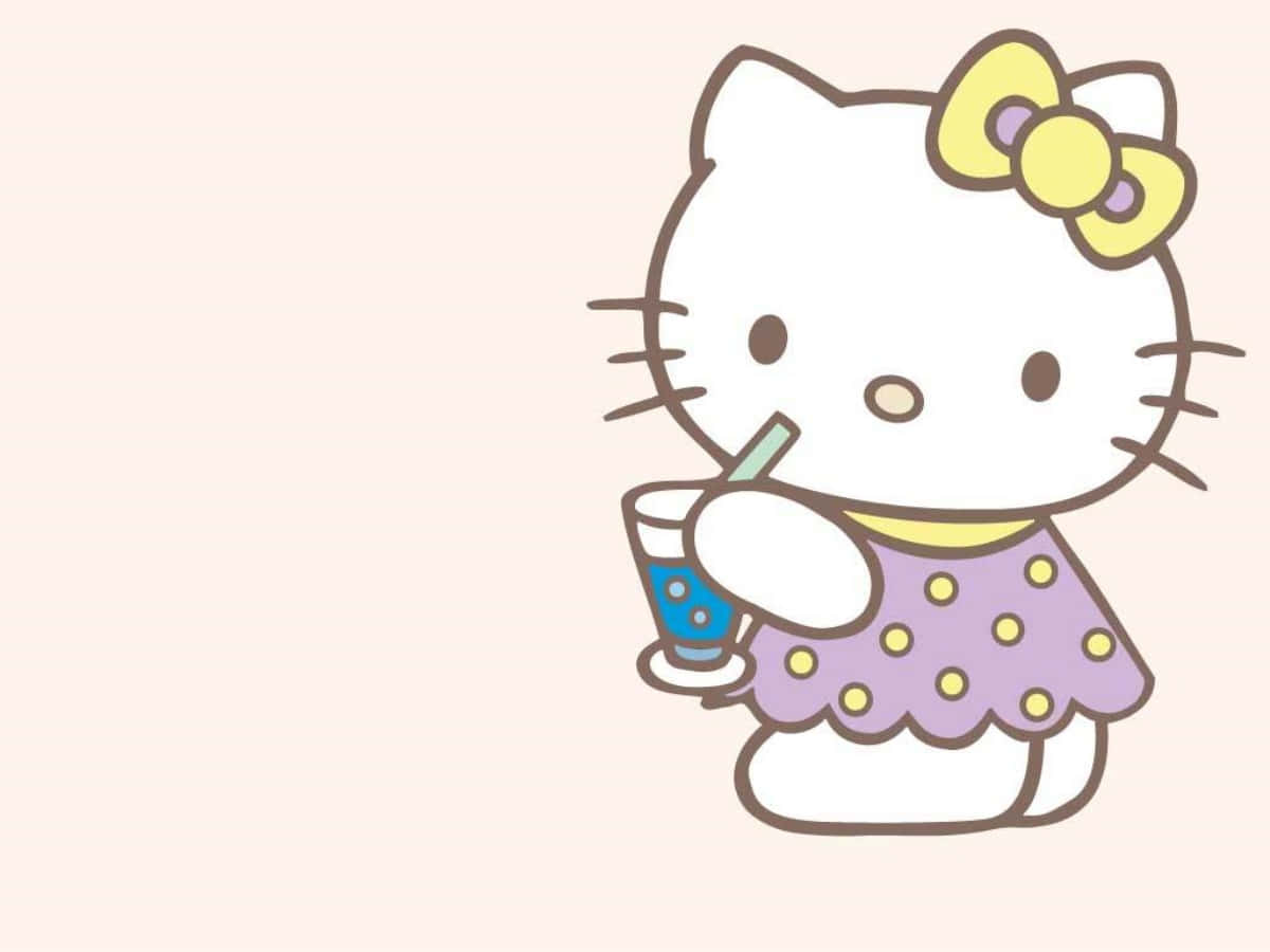 Hello Kitty tietokoneella juomaa siemaillen Taustakuvat