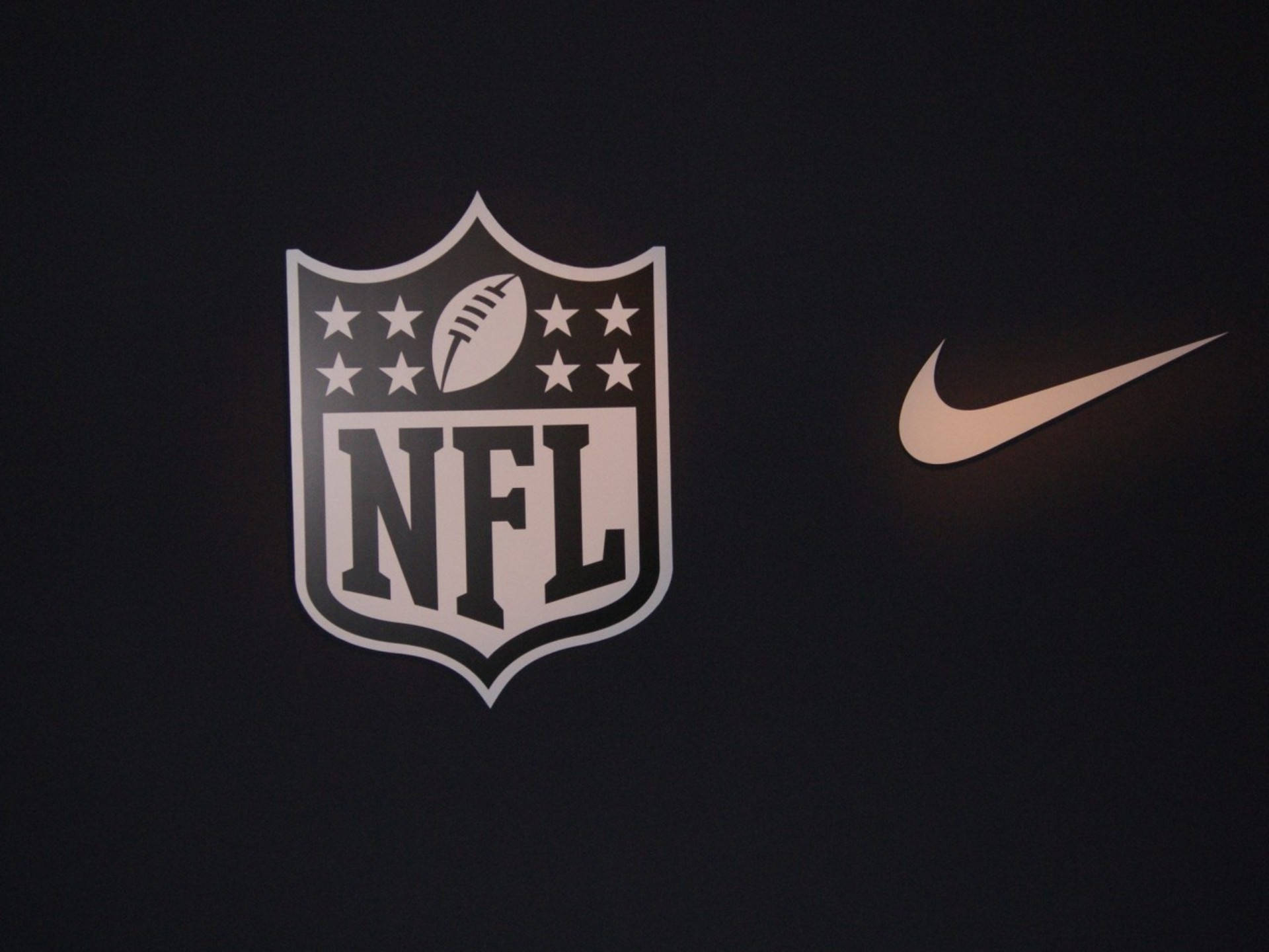 NFL-jalkapallon ja Niken logot Taustakuvat