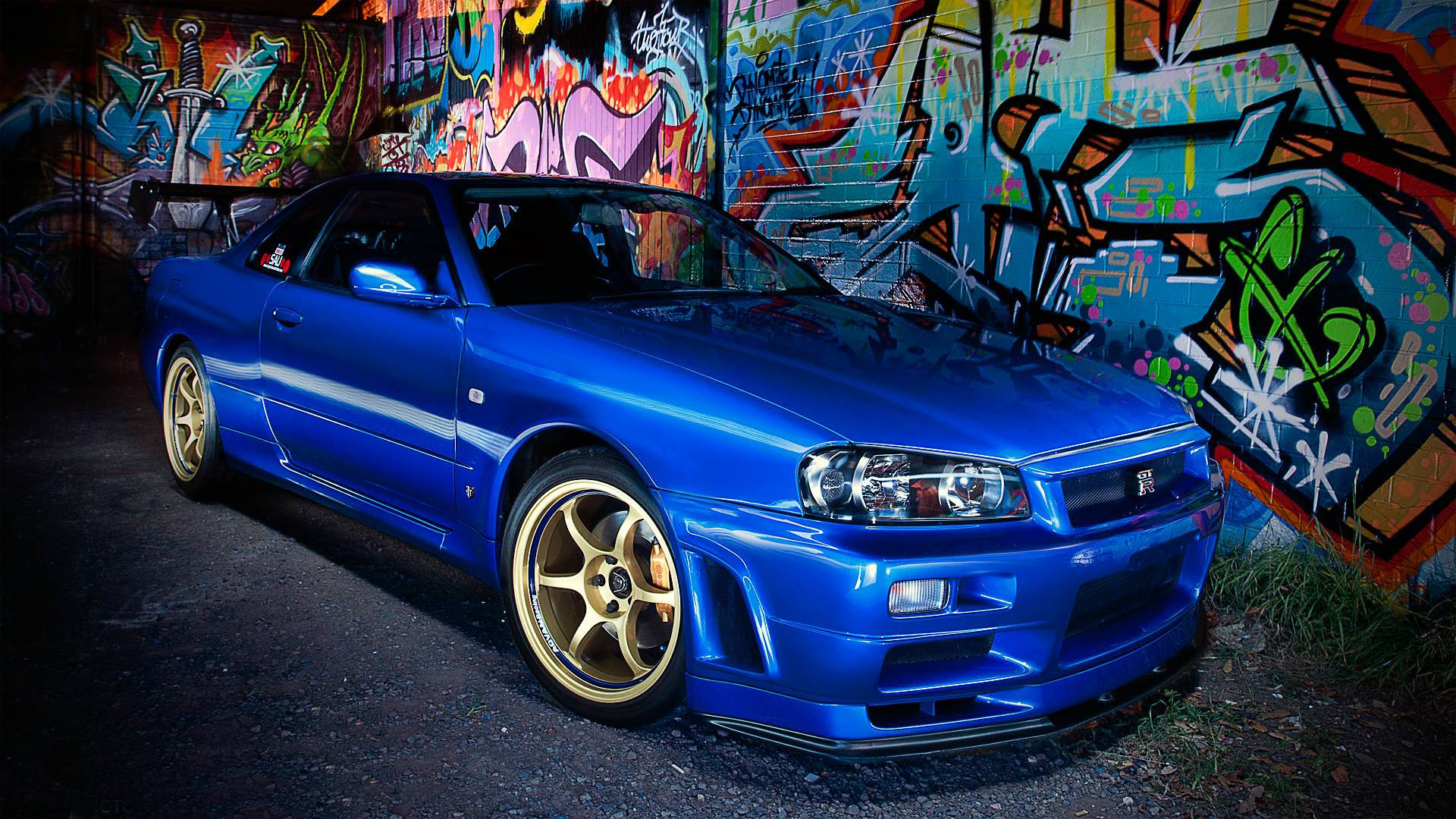 Nissan Skyline GTR R34 lähellä graffitia Taustakuvat