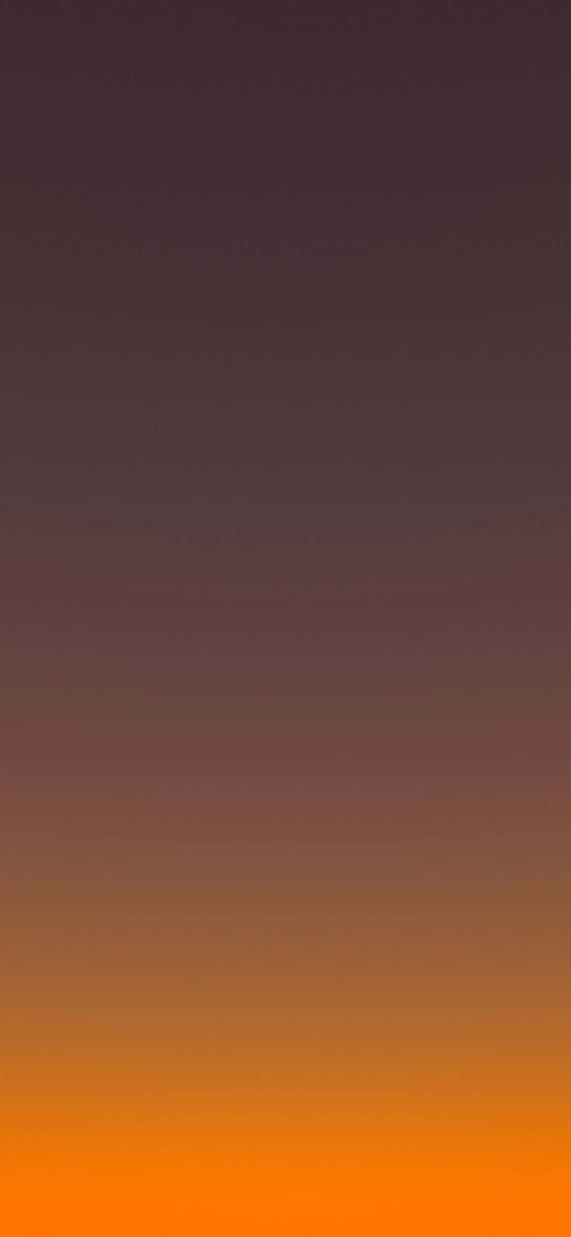 oranssi ja keltainen auringonlasku vuoren kanssa taustalla Taustakuvat