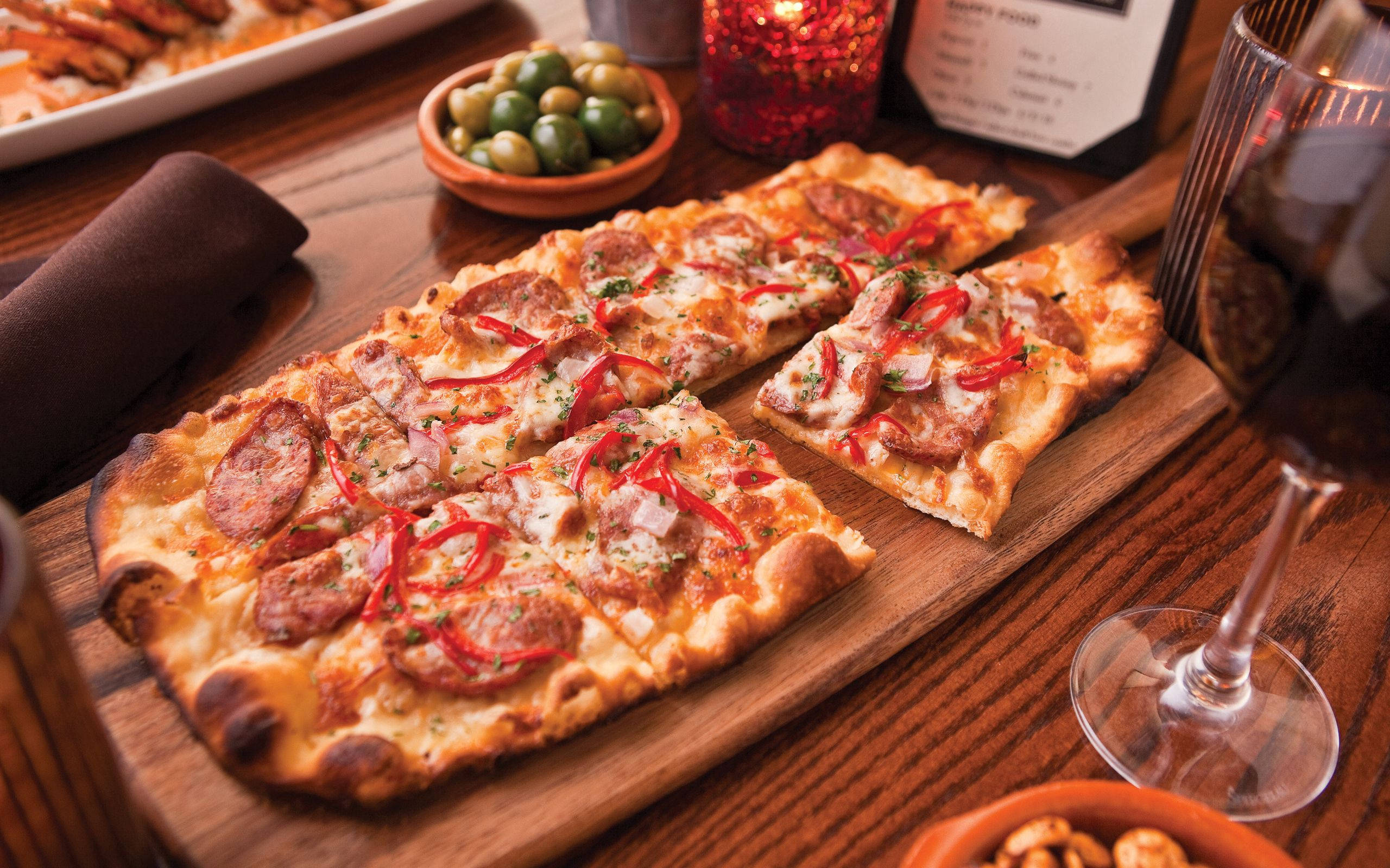 Pizzaruokaa laudalla Taustakuvat
