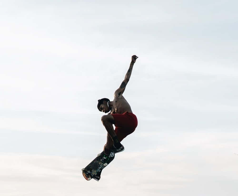 Rullalautailemassa puistoissa skater boy -tyylillä Taustakuvat