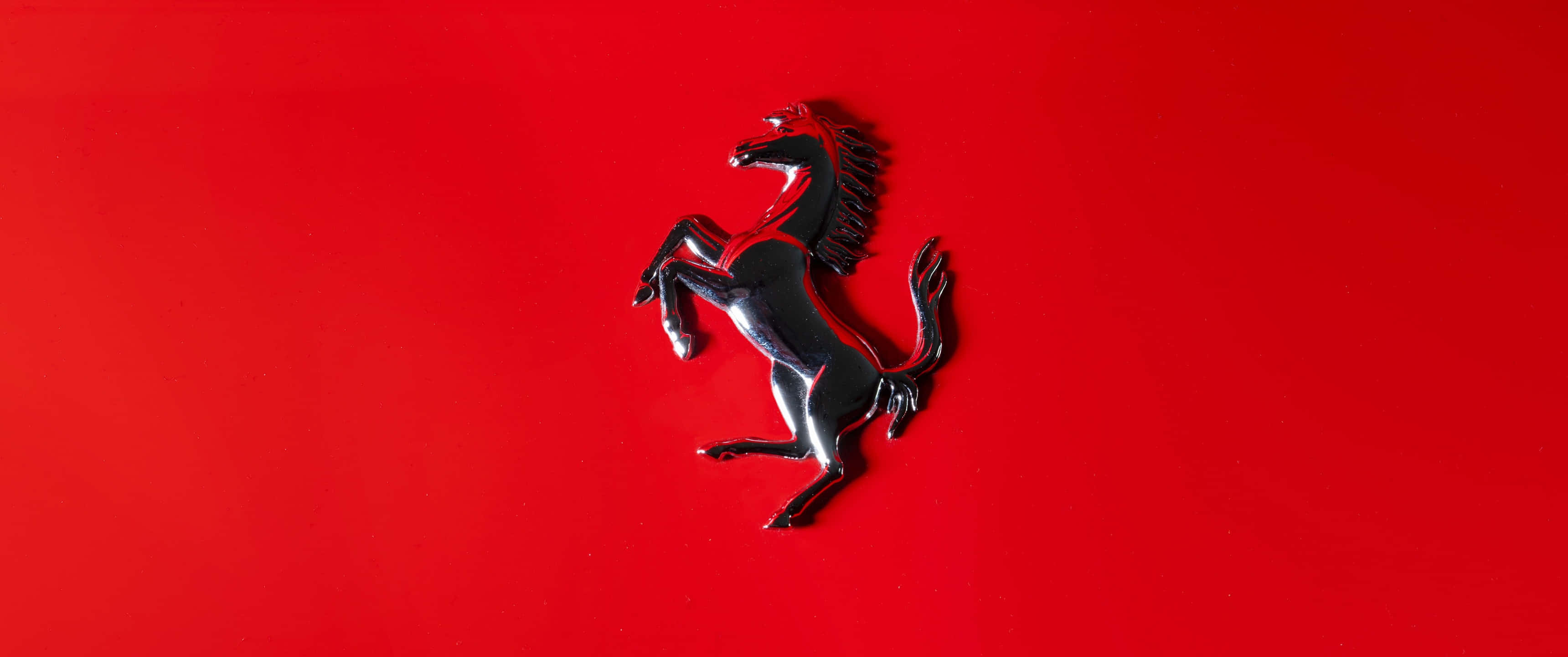 Silmäänpistävä Ferrarin automerkin logotausta Taustakuvat