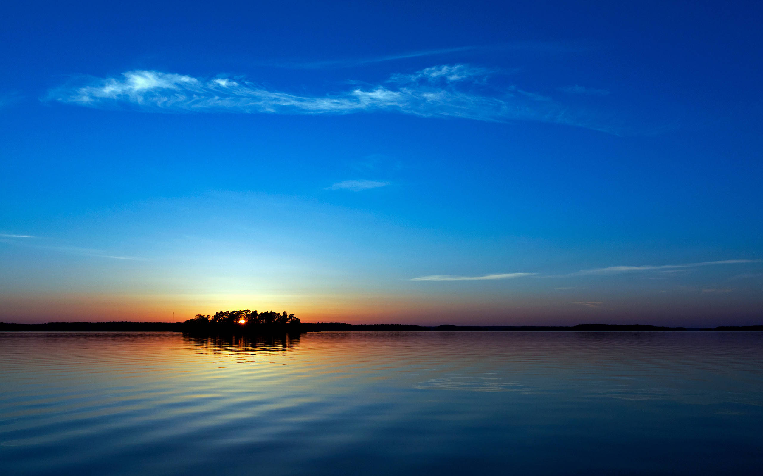 Sininen auringonlaskun saaren näytönsäästäjä Taustakuvat