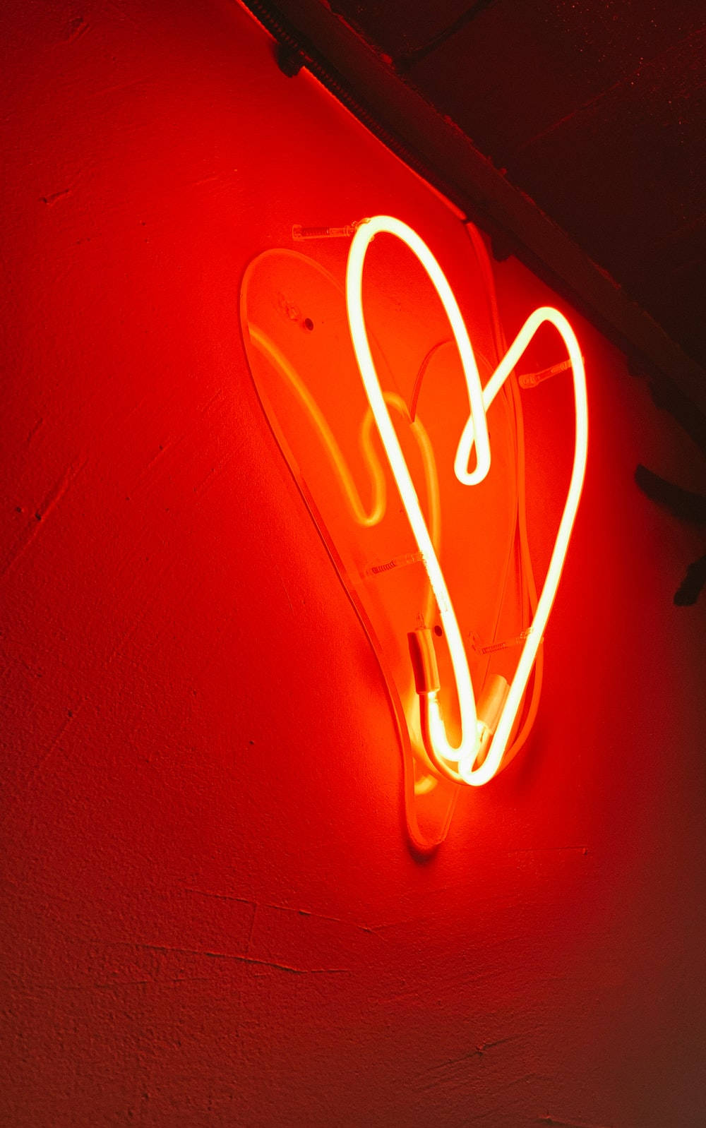 Sydänesteettinen punainen neonvalo Taustakuvat