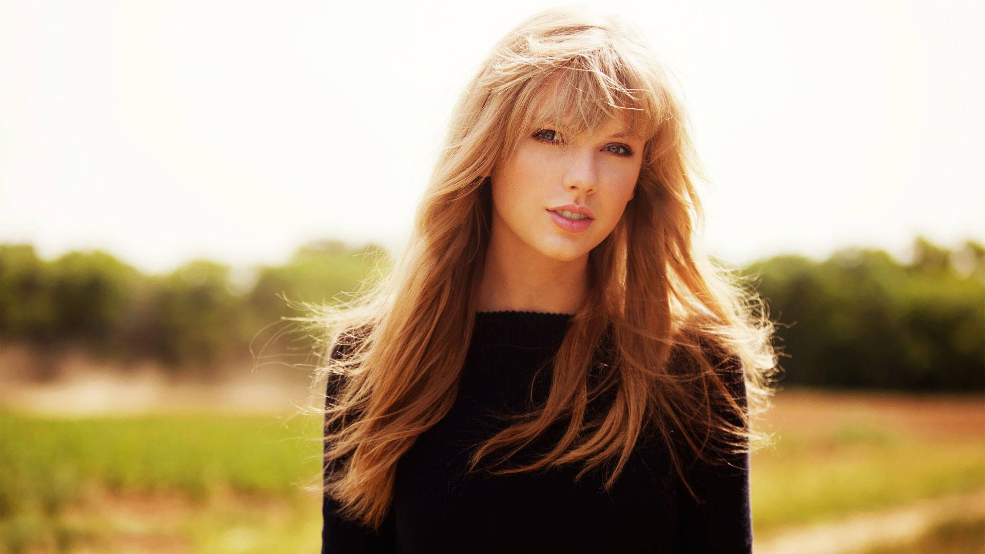 Taylor Swift auringon alla -valokuvataustakuva