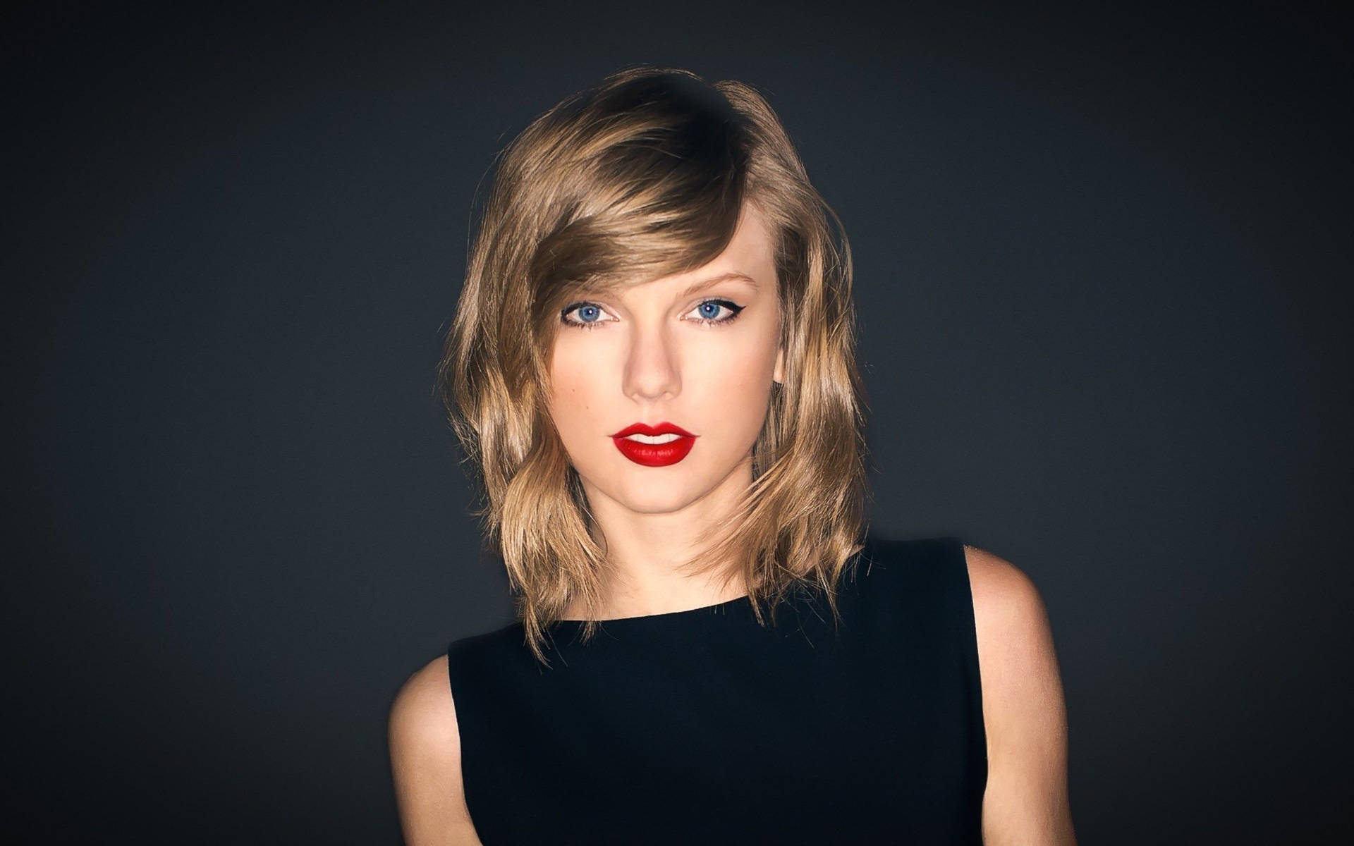 Taylor Swift musta hihaton toppi valokuvaus -taustakuva.