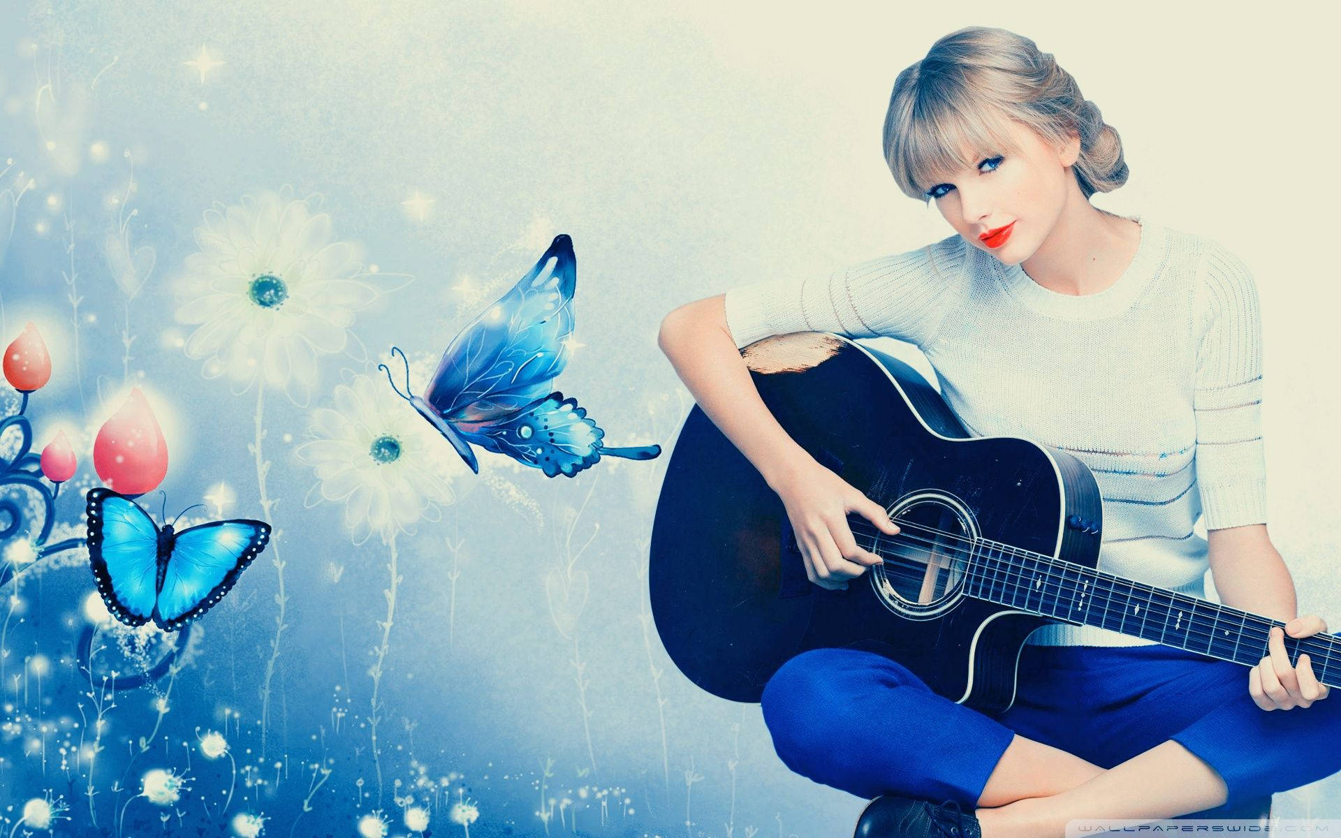 Taylor Swift soittamassa kitaraa täysillä Taustakuvat