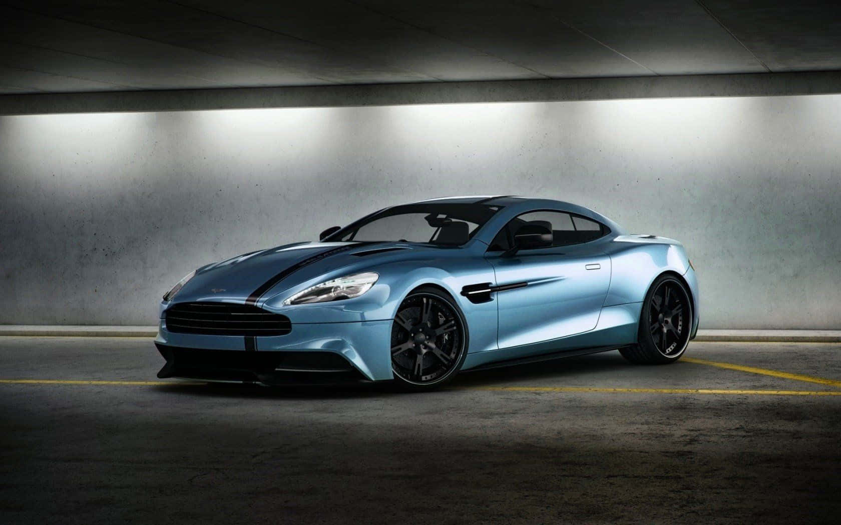 Tyylikäs Aston Martin Vanquish liikkeessä Taustakuvat