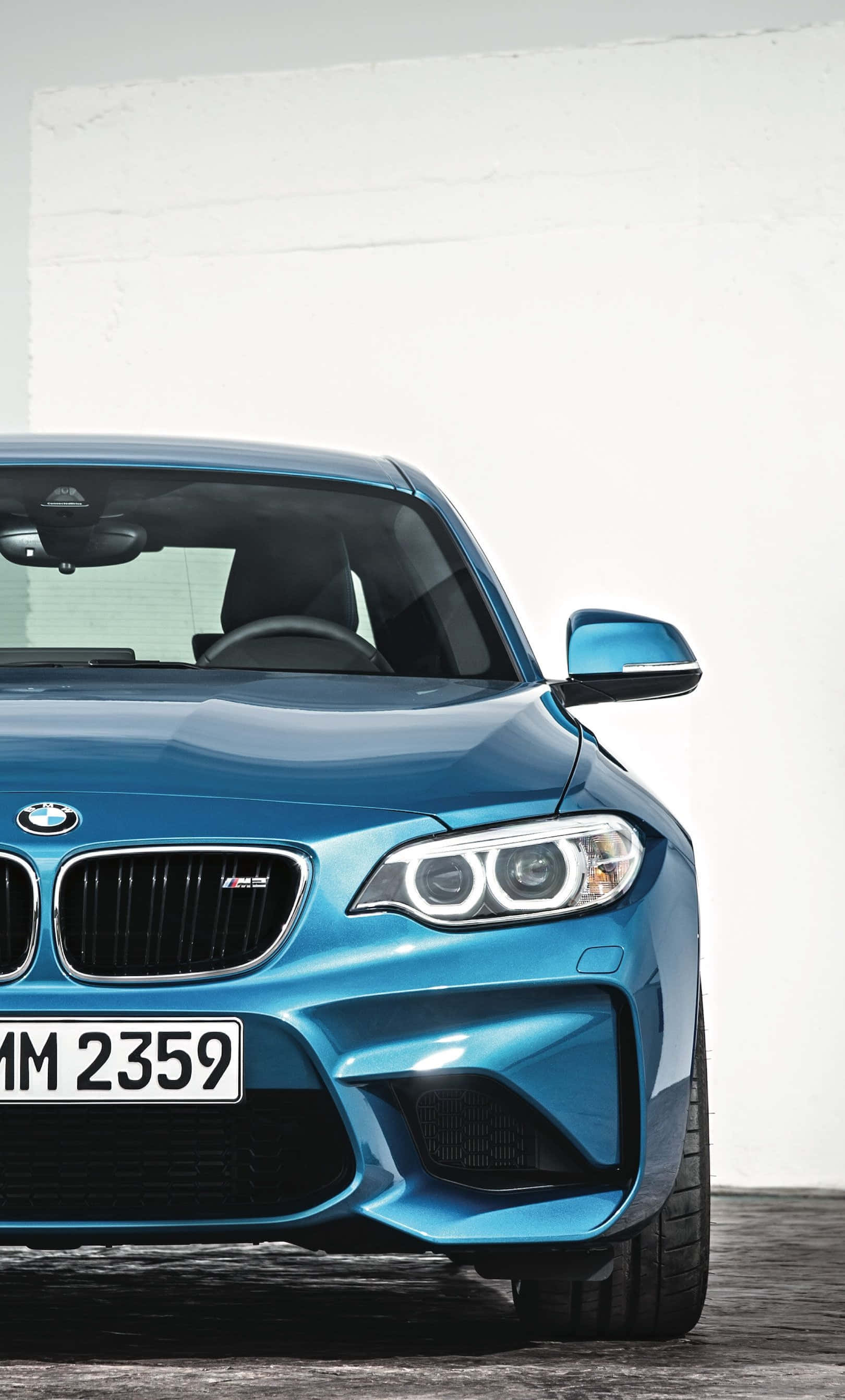 Tyylikäs BMW iPhone-taustakuva elegantilla urheiluautolla ja logolla Taustakuvat
