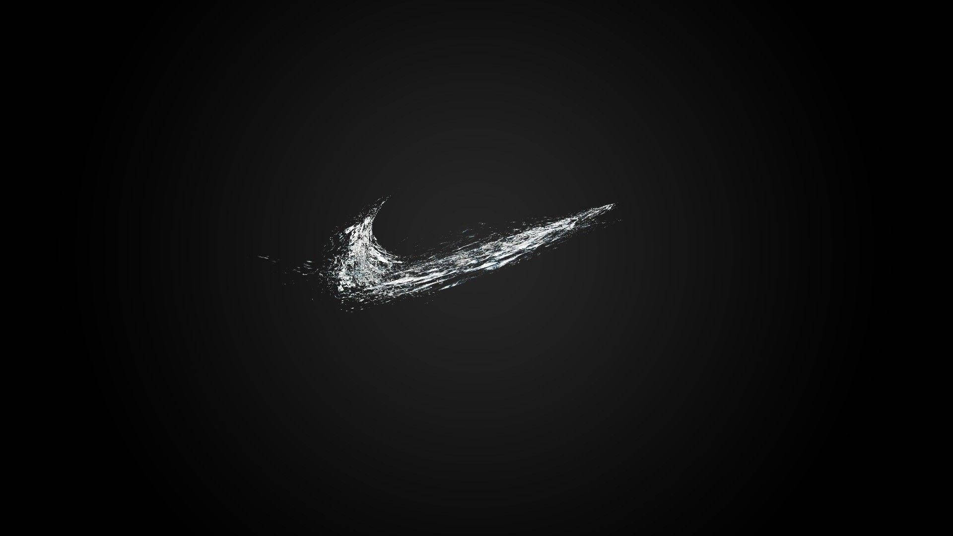 Yksinkertainen Nike-logo, siisti musta tikkukala katsomassa tietokonetta Taustakuvat