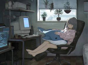 Anime-tyttö nukkumassa läppärin edessä