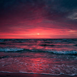 Auringonlaskun aallot iPad Retina -taustakuva
