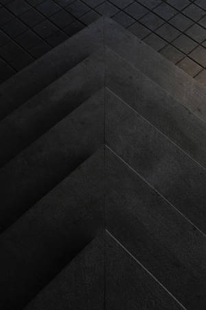 Geometrinen kolmio sementti tumma tila — Musta Taustakuvat
