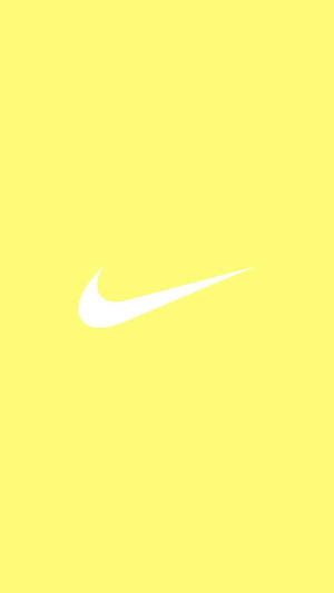 Hipnoottinen pastellikeltainen estetiikka ikonisella Nike-logolla — Pastellinkeltainen estetiikka Taustakuvat