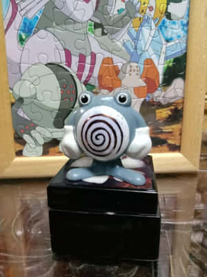Keraaminen Poliwhirl-patsas palapelin edessä — Pokemon Taustakuvat