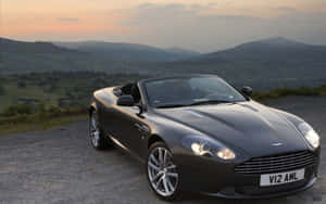 Kuvateksti: Tyylikäs Aston Martin DB9 tiellä — Steam Deck Taustakuvat