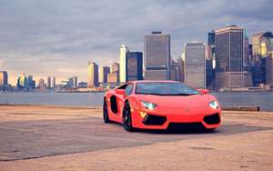 Autotaustakuva punaisesta Lamborghini Aventadorista Brooklyn Bridge Parkissa.