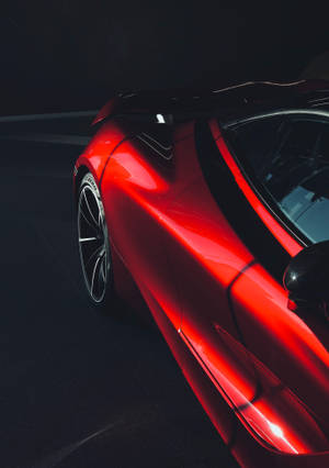 Pätkä punaisesta McLaren 720s -autosta mustalla taustalla -taustakuva — OnePlus Pad 3 Taustakuvat