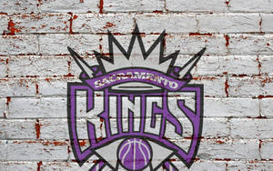 Sacramento Kings -logo tiiliseinässä -taustakuva — Neutraali Taustakuvat