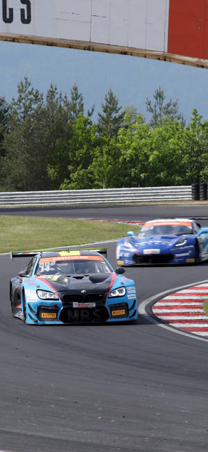 Sininen BMW M6 GT3 -Kilpa-auto iPhone — Galaxy S24 Taustakuvat