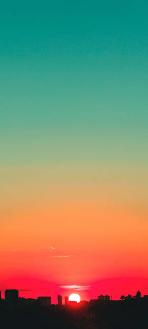 Teal ja punainen auringonlaskun taivas -taustakuva — iPhone 16 Pro Taustakuvat