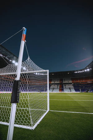 Jalkapallostadion maalitolppa yötaivas mobiilitaustakuva.