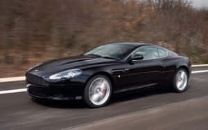 Tyylikäs Aston Martin DB9 avoimella tiellä — Steam Deck Taustakuvat