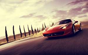 Autotapetti punaisesta Ferrari 458 Italiasta liikkeessä.